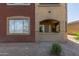 Cozy condo exterior featuring stucco walls, an open balcony, and manicured landscaping at 5401 E Van Buren St # 1088, Phoenix, AZ 85008