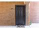 Condo front door entrance with a black door, unit number 1088, and a colorful welcome mat at 5401 E Van Buren St # 1088, Phoenix, AZ 85008
