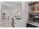 Open kitchen featuring a stainless steel sink, updated appliances, and a view into the living room at 5401 E Van Buren St # 1088, Phoenix, AZ 85008