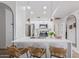 Bright kitchen with modern pendant lights, stainless steel appliances, and counter seating at 5401 E Van Buren St # 1088, Phoenix, AZ 85008