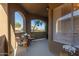 Comfortable patio area with view through arches, perfect for relaxing or entertaining at 5401 E Van Buren St # 1088, Phoenix, AZ 85008