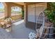 Covered patio featuring comfortable seating, decorative plants, and relaxing ambiance at 5401 E Van Buren St # 1088, Phoenix, AZ 85008