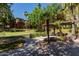 Community putting green with shaded picnic area, perfect for outdoor recreation and relaxation at 5401 E Van Buren St # 1088, Phoenix, AZ 85008