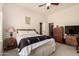 Inviting bedroom features a ceiling fan, cozy furnishings, and ample natural light at 5534 W Riviera Dr, Glendale, AZ 85304