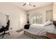 Neutral bedroom features a ceiling fan and ample natural light at 5534 W Riviera Dr, Glendale, AZ 85304