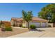 Beautiful home with a spacious three-car garage and well-manicured landscaping, creating a welcoming exterior at 5534 W Riviera Dr, Glendale, AZ 85304