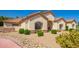 Charming front yard with desert landscaping, offering a low-maintenance and visually appealing exterior at 5534 W Riviera Dr, Glendale, AZ 85304