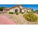 Attractive single-story home with desert landscaping, showcasing curb appeal and Southwestern charm at 5534 W Riviera Dr, Glendale, AZ 85304