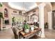 Bright and airy living room featuring tile flooring, a fireplace, and access to outdoor living at 5534 W Riviera Dr, Glendale, AZ 85304