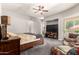 Spacious main bedroom offers cozy seating, a ceiling fan, and a beautiful view at 5534 W Riviera Dr, Glendale, AZ 85304