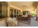 Inviting covered patio area featuring comfortable seating, perfect for outdoor dining and relaxation at 5534 W Riviera Dr, Glendale, AZ 85304