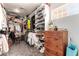 Walk-in closet boasts ample storage solutions with shelving and drawers for organization at 5534 W Riviera Dr, Glendale, AZ 85304