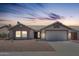 Charming single-story home with well-maintained landscaping and a two-car garage at 5919 W Blackhawk Dr, Glendale, AZ 85308