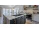 Well-appointed kitchen with a center island, modern appliances, and ample counter space at 5919 W Blackhawk Dr, Glendale, AZ 85308