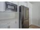 Elegant kitchen featuring stainless steel appliances, custom cabinets, and ample storage at 5919 W Blackhawk Dr, Glendale, AZ 85308