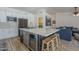 Modern kitchen with a large center island, stainless steel appliances, and sleek cabinetry at 5919 W Blackhawk Dr, Glendale, AZ 85308