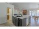 Stylish kitchen island with a sink and breakfast bar, perfect for casual dining at 5919 W Blackhawk Dr, Glendale, AZ 85308