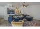 Cozy living room featuring a plush sectional sofa and stylish decor at 5919 W Blackhawk Dr, Glendale, AZ 85308