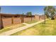 Neighborhood exterior view with grass and walkway at 6008 W Augusta Ave, Glendale, AZ 85301