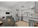 Updated kitchen with white cabinets, stainless steel appliances and eat-in space at 6008 W Augusta Ave, Glendale, AZ 85301