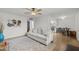 Living room flows into updated kitchen, with a ceiling fan and an eat-in space at 6008 W Augusta Ave, Glendale, AZ 85301