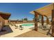 Community pool area featuring lounge chairs and desert landscaping at 6008 W Augusta Ave, Glendale, AZ 85301