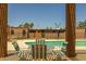 Inviting community pool with a seating area under a pergola for residents at 6008 W Augusta Ave, Glendale, AZ 85301
