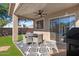 Cozy covered patio with outdoor seating, ideal for relaxation and dining al fresco at 7027 W Midway Ave, Glendale, AZ 85303