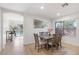 Inviting dining room with natural light, tile floors, and an archway leading to an outdoor pool view at 7027 W Midway Ave, Glendale, AZ 85303