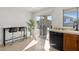 Charming kitchen with black appliances, a breakfast bar, and a sliding door leading to the outdoor patio and grill at 7027 W Midway Ave, Glendale, AZ 85303
