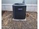 Modern air conditioning unit on a gravel surface next to a manufactured home, ensuring comfortable living at 730 S Country Club Dr # 62, Mesa, AZ 85210