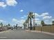 Gated community entrance lined with palm trees, providing security and a tropical feel at 730 S Country Club Dr # 62, Mesa, AZ 85210