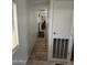 Inviting hallway offering seamless flow to living spaces with modern flooring and neutral finishes at 730 S Country Club Dr # 62, Mesa, AZ 85210