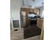 Efficient kitchen with stainless steel appliances, wood cabinets, and a window above the sink at 730 S Country Club Dr # 62, Mesa, AZ 85210
