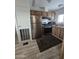 Efficient kitchen with stainless steel appliances, wood cabinets, and a window above the sink at 730 S Country Club Dr # 62, Mesa, AZ 85210