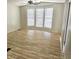 Bright living room featuring light wood flooring and a ceiling fan at 730 S Country Club Dr # 62, Mesa, AZ 85210