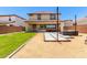 Landscaped backyard features patio seating, modern outdoor furniture, and string lights overhead at 820 E Constance Way, Phoenix, AZ 85042