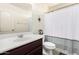 Well-lit bathroom featuring a shower-tub combination and a single sink vanity at 820 E Constance Way, Phoenix, AZ 85042