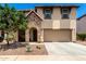 Charming two-story home featuring a stone-accented entrance and a well-maintained front yard at 820 E Constance Way, Phoenix, AZ 85042