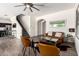 Comfortable living room features a ceiling fan and modern decor, ideal for relaxing and entertaining at 820 E Constance Way, Phoenix, AZ 85042