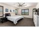 Serene main bedroom features modern decor, plantation shutters, and a spacious layout at 820 E Constance Way, Phoenix, AZ 85042