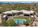Stunning aerial view of the property showcasing the pool, outdoor areas, and overall layout at 8306 E Buckskin Trl, Scottsdale, AZ 85255