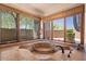 Bathroom features a tiled jacuzzi tub surrounded by windows with outdoor views at 8306 E Buckskin Trl, Scottsdale, AZ 85255