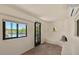 Bright bedroom with a door leading to the patio and a view of the backyard pool at 8306 E Buckskin Trl, Scottsdale, AZ 85255