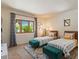 Bright bedroom featuring twin beds, large windows, and a decorative accent rug at 8306 E Buckskin Trl, Scottsdale, AZ 85255