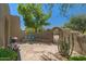 Charming courtyard with a built-in bench, decorative pillows, and lush desert plants at 8306 E Buckskin Trl, Scottsdale, AZ 85255