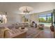 Elegant living room with ample seating, views of the pool, and stylish desert decor at 8306 E Buckskin Trl, Scottsdale, AZ 85255