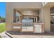 Outdoor kitchen featuring a stainless steel grill and refrigerator, set in an outdoor living space at 8306 E Buckskin Trl, Scottsdale, AZ 85255