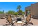 Cozy outdoor seating area with comfortable chairs surrounding a center fire pit at 8306 E Buckskin Trl, Scottsdale, AZ 85255