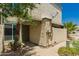 Exterior of condo with sand-colored stucco, front security door, sidewalk and palm trees at 9011 N 52Nd Ave, Glendale, AZ 85302